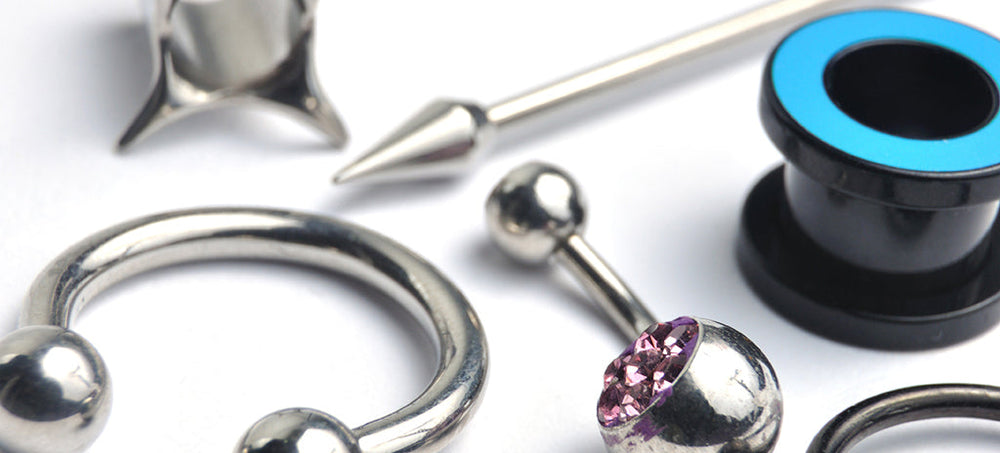 Hypoallergenic Options for Body Jewellery. Silicone Ear Stretchers and Stainless Steel Body Jewellery on a white background.