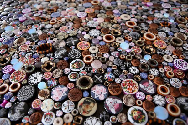 Hundreds of ear plugs displayed across a table
