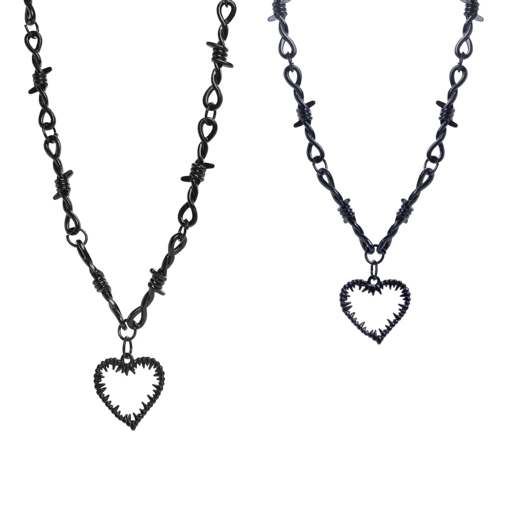 Two barbed wire necklaces with heart pendants on a white background