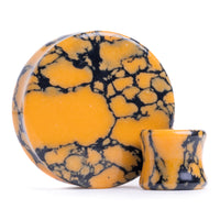 Plug en pierre marbrée noire et orange / calibre