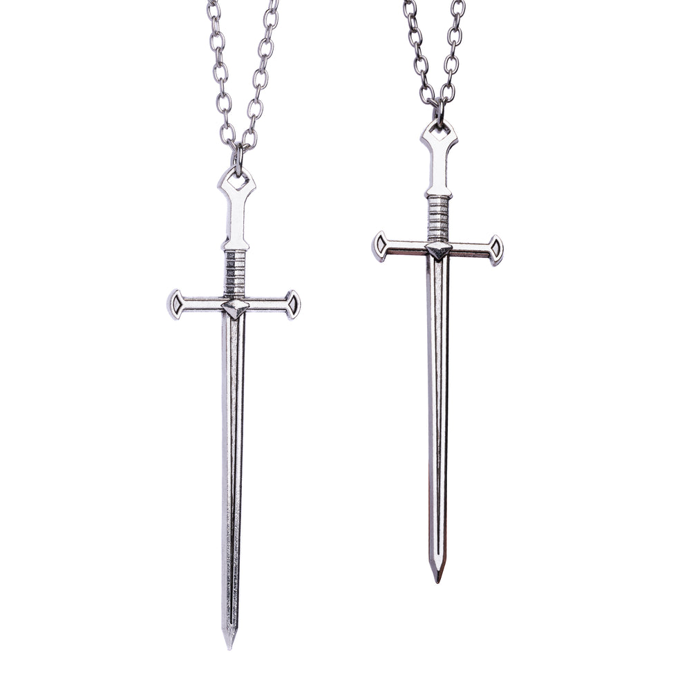 Two silver sword necklaces with stainless steel pendants, one with a pointed tip and one with a flat tip, both on silver chains.