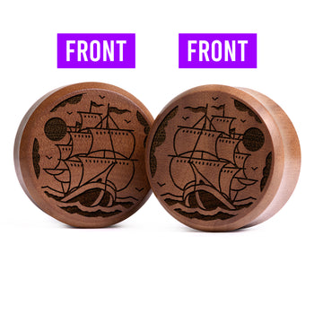 Woman wearing awesome demon face acrylic inlay and wood plugs / gauges