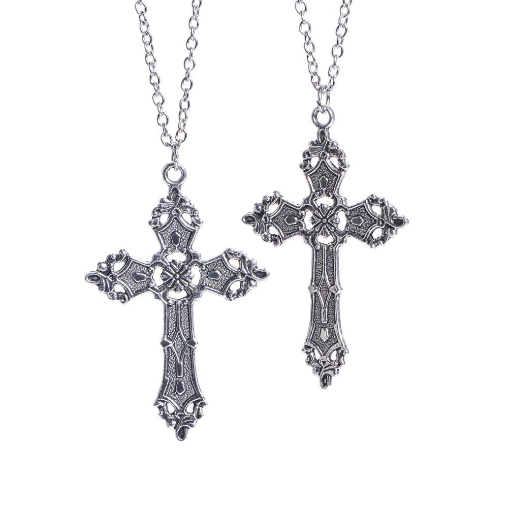 Two gothic cross necklaces with intricate detailing, hanging on chains.
